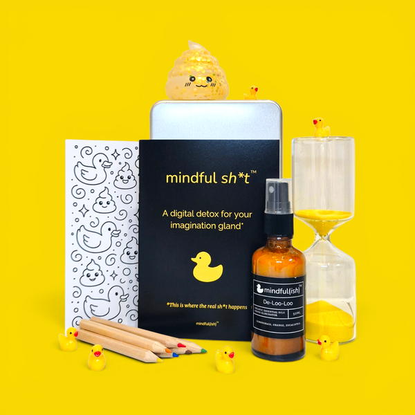 The mindful sh*t Kit contents flat lay — zine, phone jail tin, squishy poo pal, hourglass, De-Loo-Loo bathroom spray, colouring postcard, mini pencils, and rubber ducks on yellow background